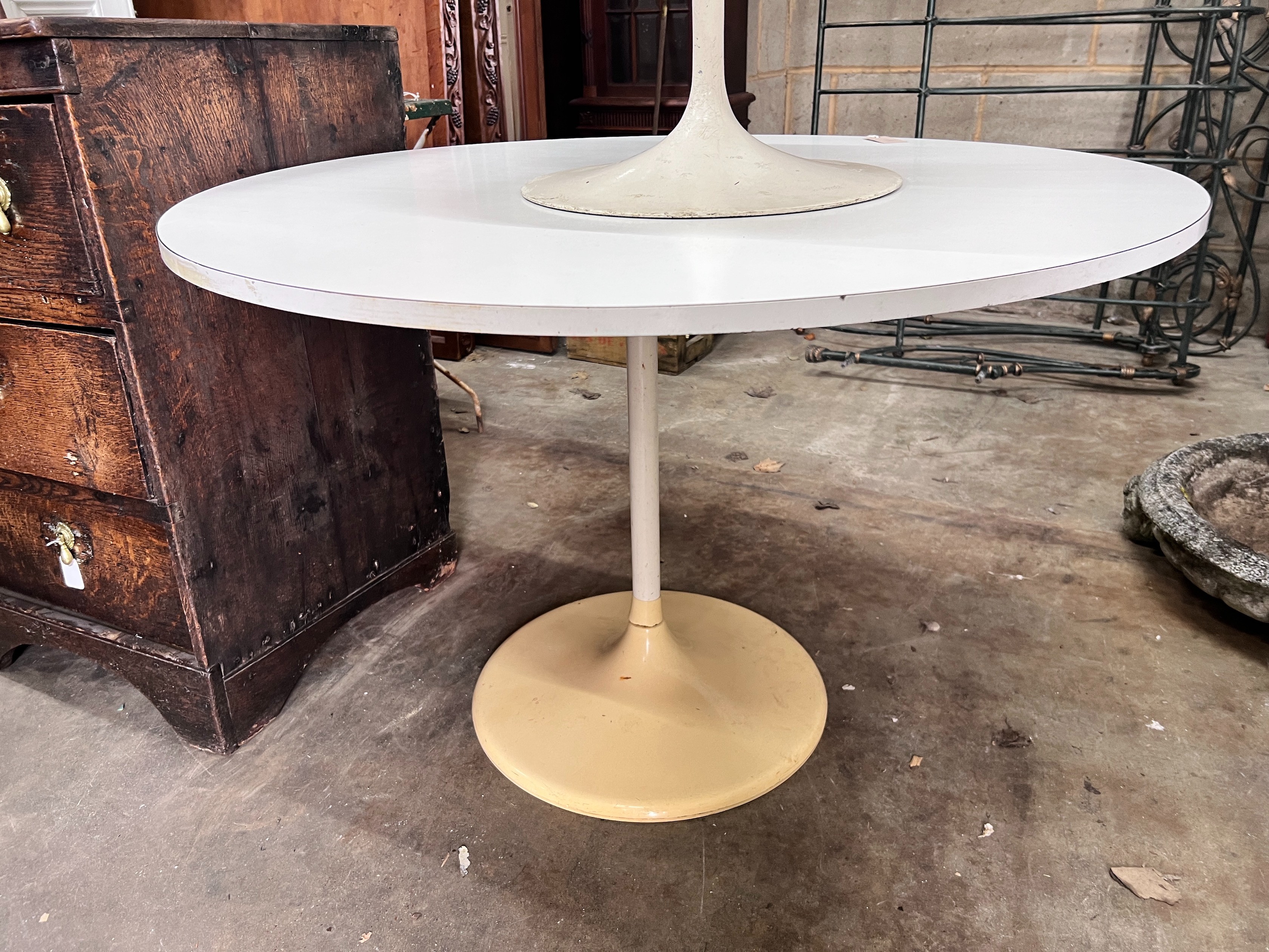 A small mid century white melamine topped ‘Tulip’ design table, 101cm, and a single matching chair *Please note the sale commences at 9am.